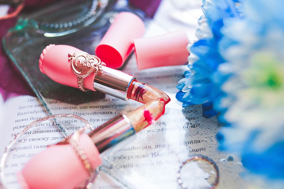 two pink lipsticks on table, travel, close-up, people, human body part HD wallpaper