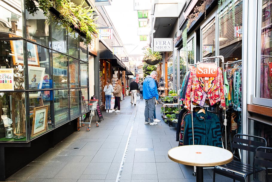 bright, view, narrow, shop, street, man, nature, plant, clothing HD wallpaper