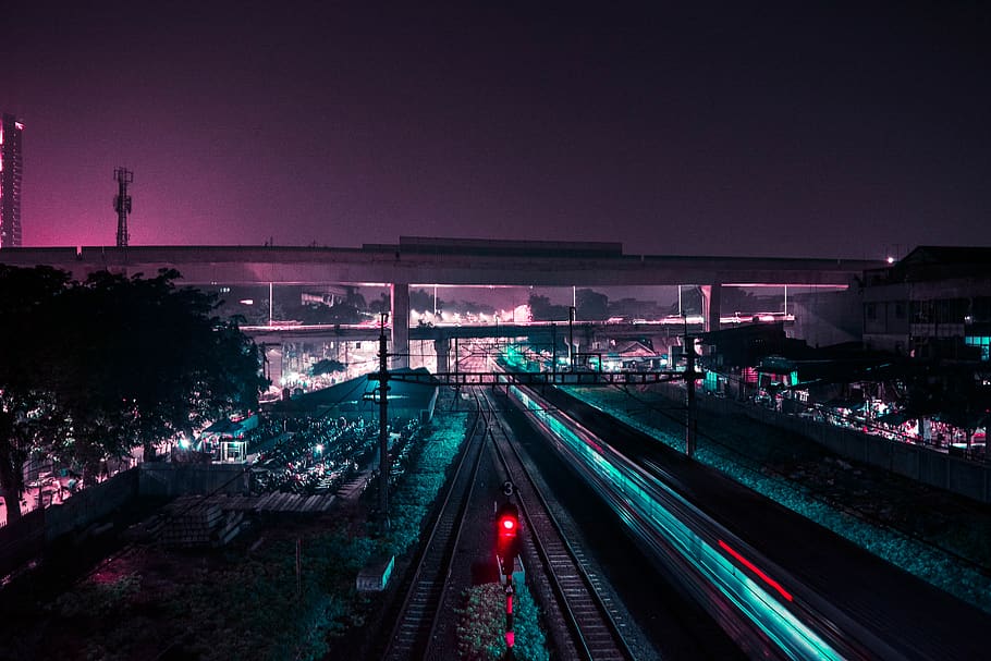 HD wallpaper: lighted train rail way during nighttime, road, terminal ...