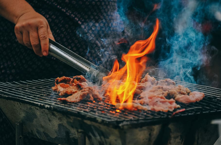 Close-Up Photo of Man Cooking Meat, barbecue, barbecue grill