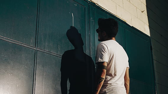 Back View Photo of Man in White T-shirt Facing Black Gate, shadow HD wallpaper