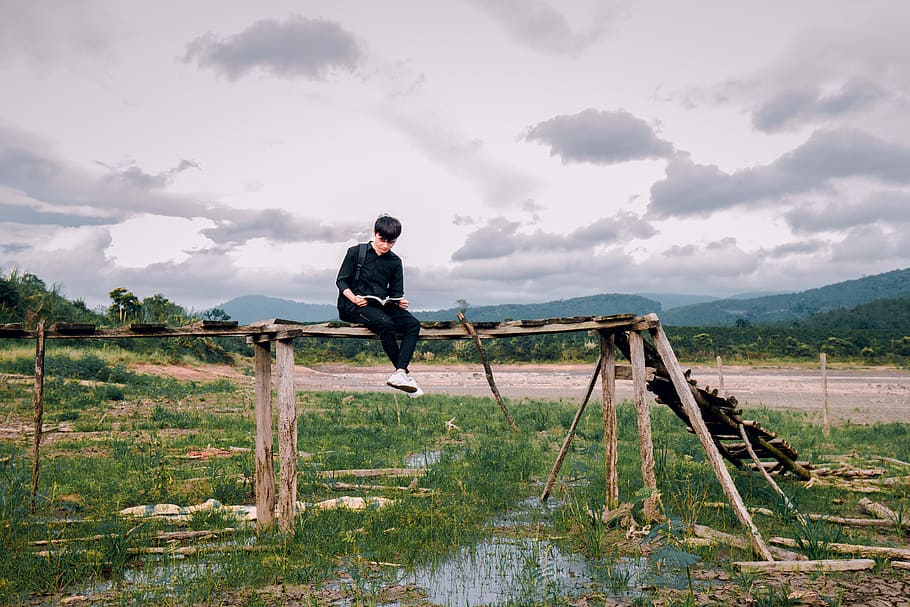Man Sitting on Brown Wooden Bridge, alone, black, daylight, daytime HD wallpaper