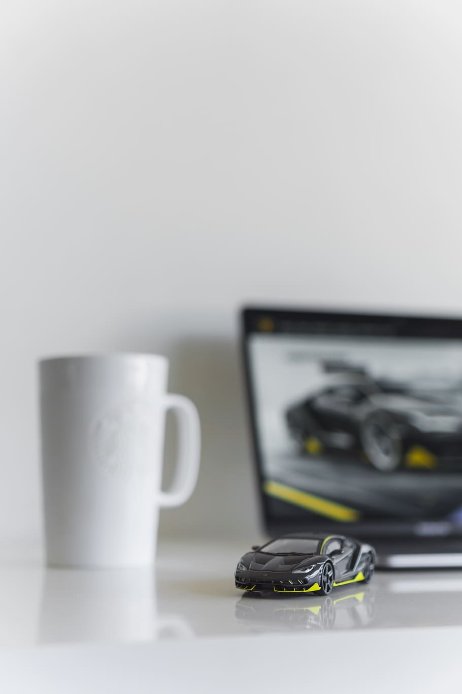 black coupe scale model on white surface, cup, mug, coffee cup HD wallpaper