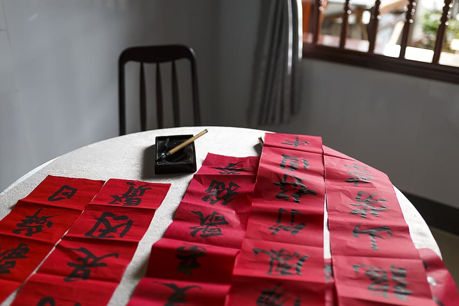 Red Papers With Black Text On Top Of Table, writing, indoors HD wallpaper