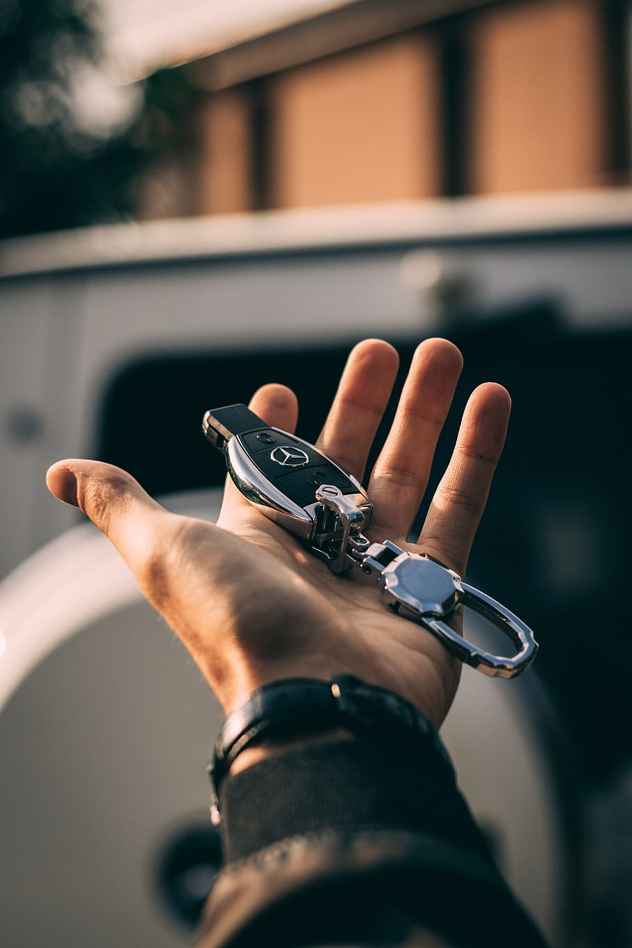 person holding Mercedes-Benz fob, hand, key, car, vehicle, travel