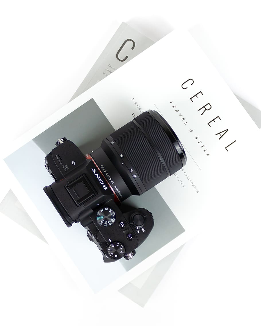 black DSLR camera on Cereal book, still life, indoors, technology HD wallpaper