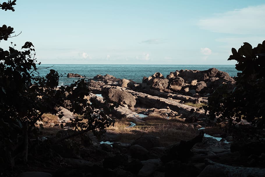Boulders Near Body of Water, beach, clouds, coast, daylight, environment HD wallpaper