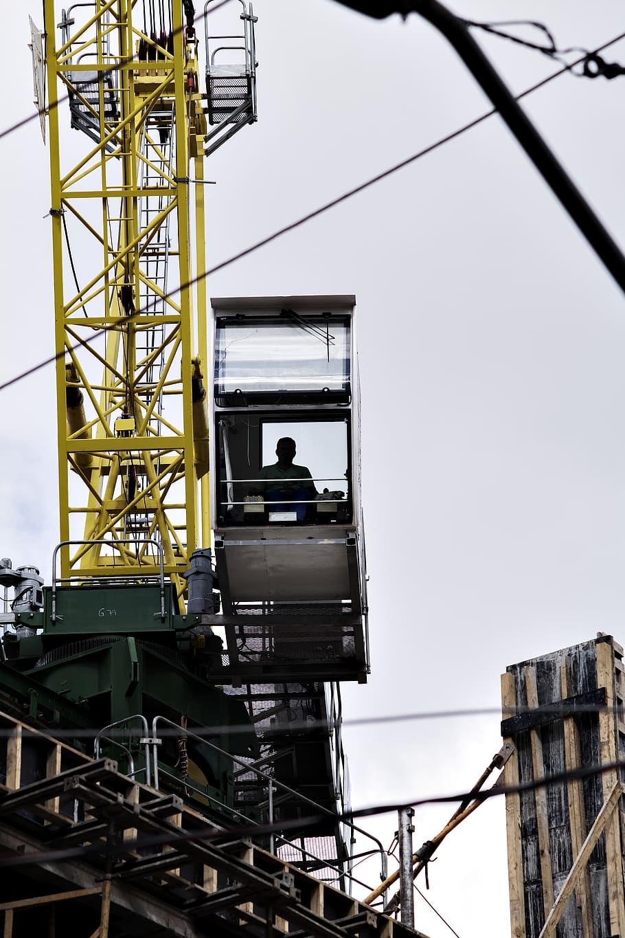 man sitting on crane tower, silhouette, são paulo, brazil, person HD wallpaper