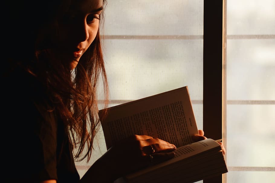 Close-Up Photography of a Woman Reading, beautiful, book, face HD wallpaper