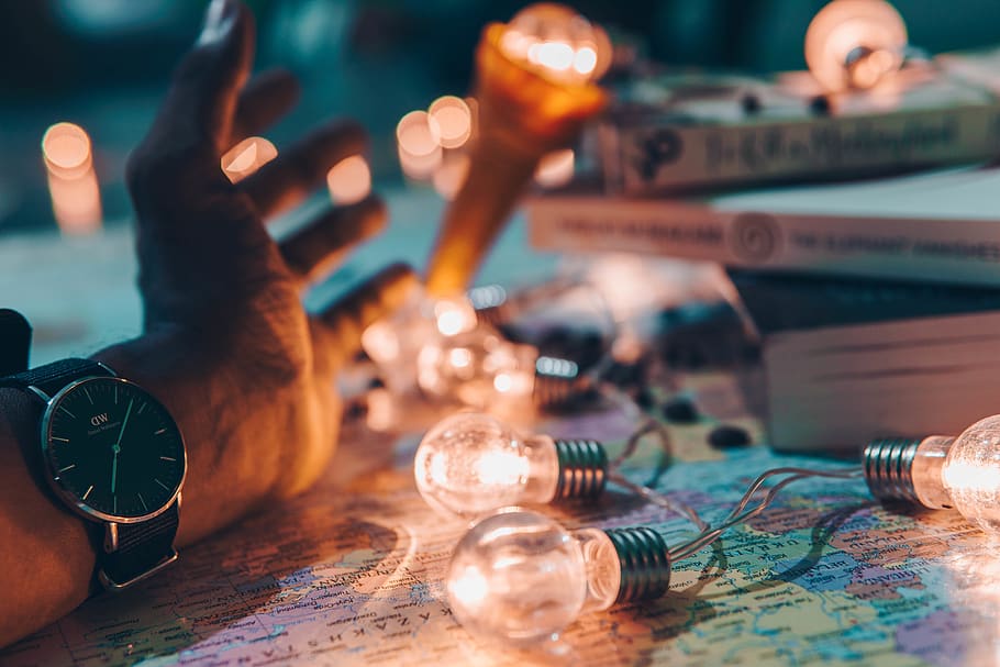 person resting hand near string light, table, close-up, indoors HD wallpaper