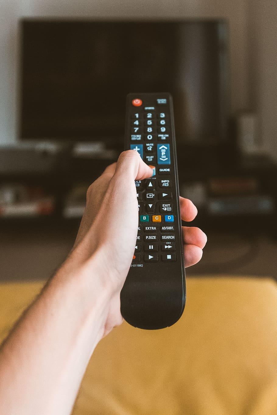 Person Holding Black Remote Control, hand, one, portable, technology HD wallpaper