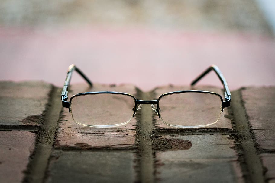 shallow focus photo of eyeglasses with silver frames, united states