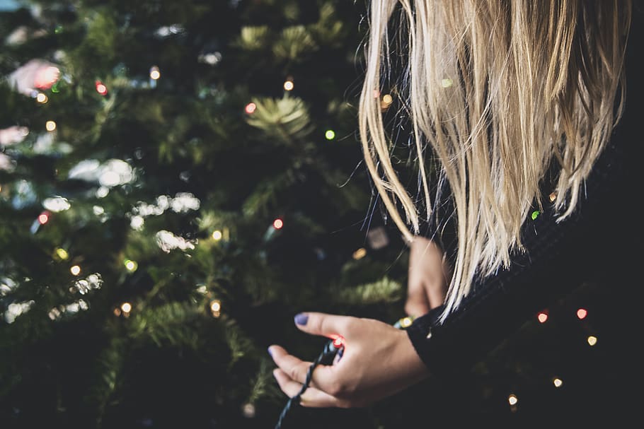 person holding multicolored string lights, one person, real people HD wallpaper
