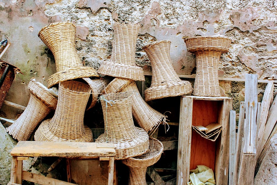 Brown Wicker Baskets and Brown Wooden Stool Beside Concrete Wall HD wallpaper