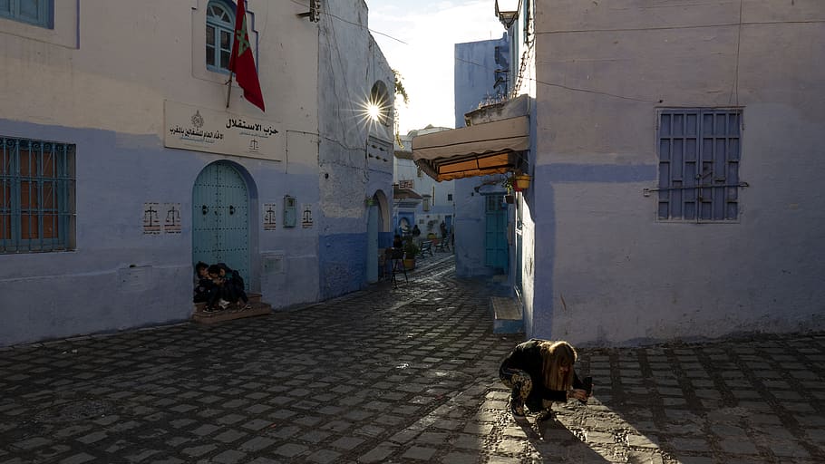 morocco, chefchaouen, darkness, lit, girl, photographer, street