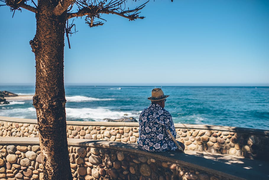 man sitting facing sea, water, horizon over water, one person HD wallpaper