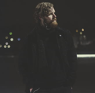 Man Wearing Black Zip-up Jacket Taking Picture during Nighttime HD wallpaper