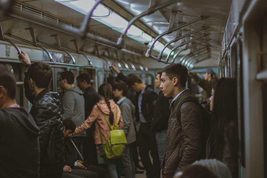 man standing in train during night time, human, person, apparel HD wallpaper