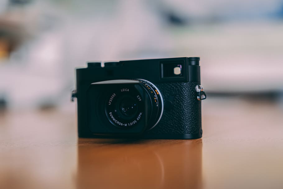 black DSLR camera on table, electronics, digital camera, strap HD wallpaper