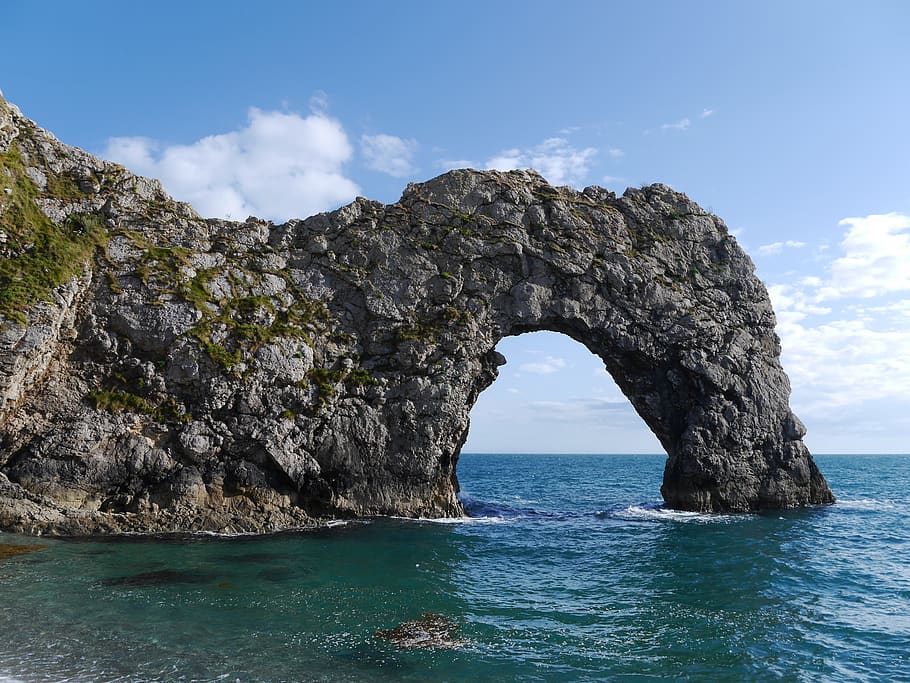 Gray Rock Formation Surrounded by Body of Water, bay, beach, clouds HD wallpaper