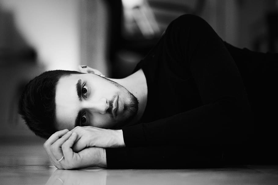 man lying down on ground, one person, young adult, portrait, indoors HD wallpaper