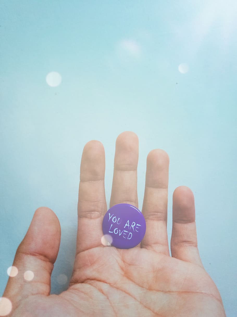 Person Holding Purple Badge You Are Loved Text-printed, bright, HD wallpaper