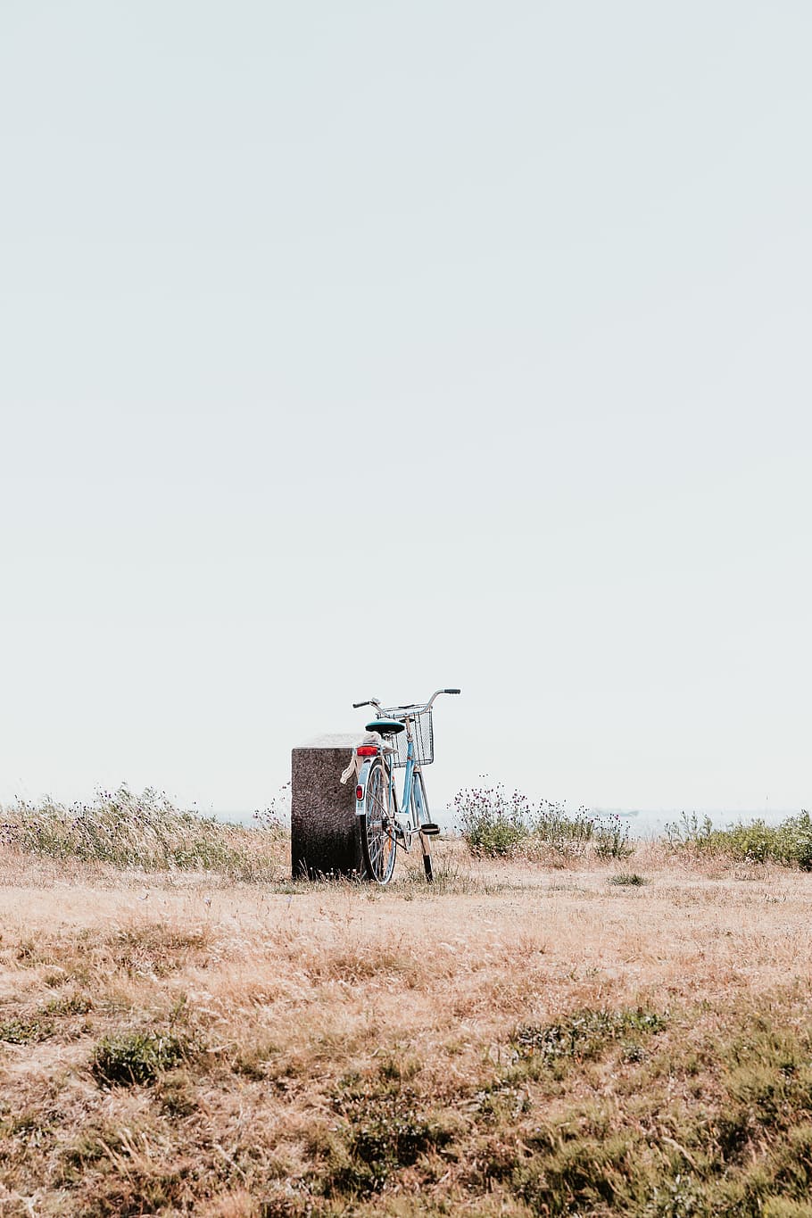blue city bike leaning on gray rock, bicycle, grass, field, parked HD wallpaper
