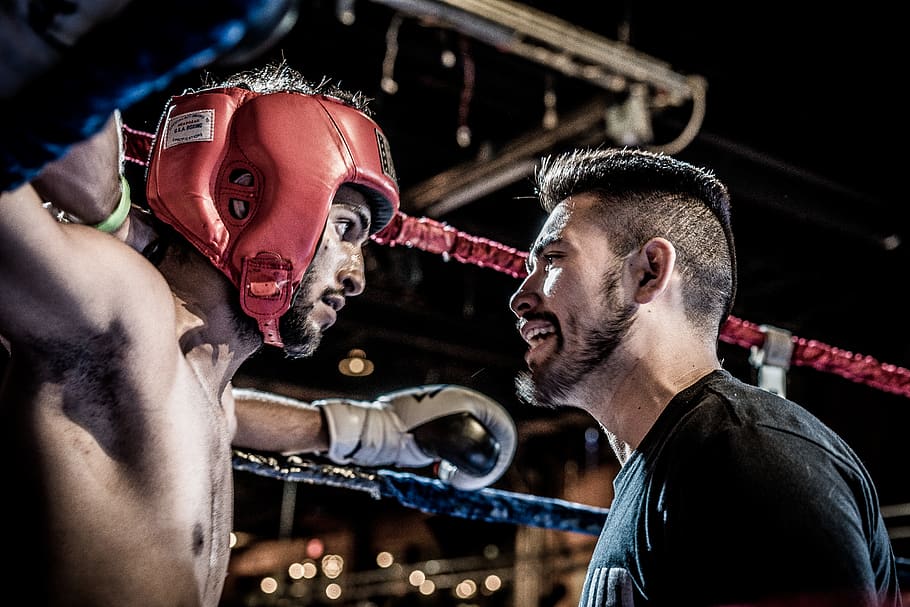 man in black talking to boxer inside ring, men, focus on foreground HD wallpaper