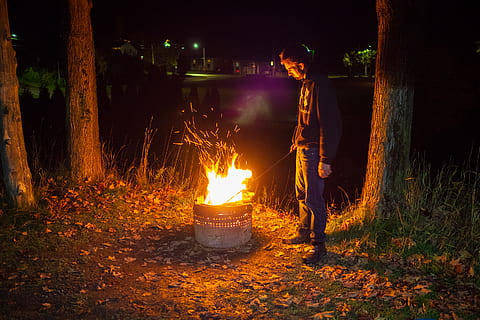 fire, human, person, flame, bonfire, camping, night, forest HD wallpaper