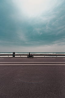 HD wallpaper: person riding motorcycle on empty road during daytime, way,  tarmac | Wallpaper Flare