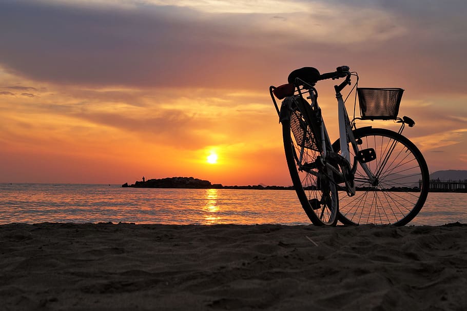 White Hard Tail Bicycle on Brown Beach Sand during Sunsets, dawn HD wallpaper