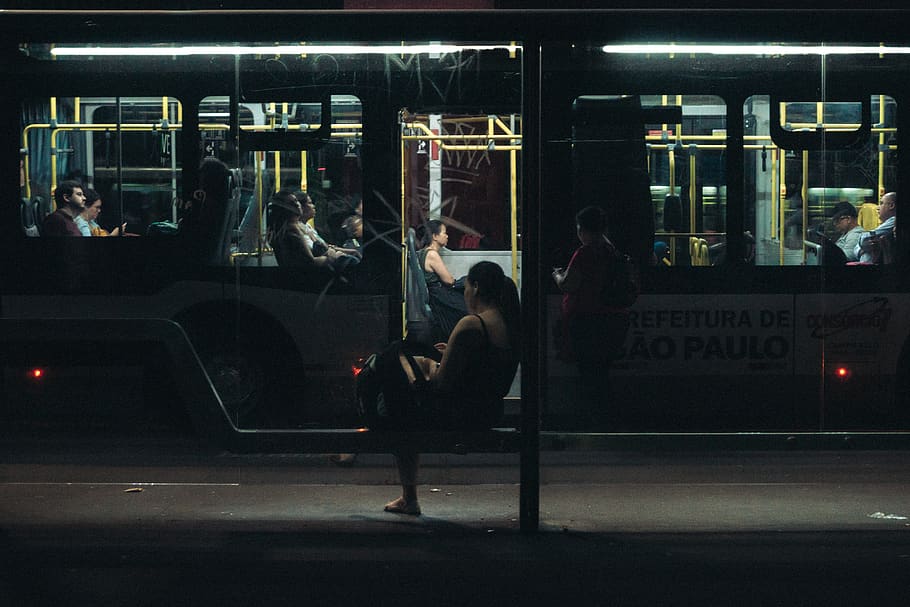 Woman Sitting on Bench during Nighttime, blur, bus, bus stop