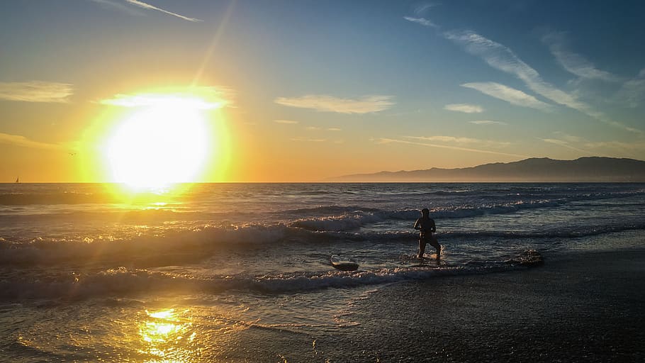 person standing on seashore, nature, human, light, flare, sunlight HD wallpaper