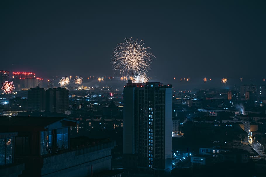 fireworks display above buildings, nature, outdoors, night, urban HD wallpaper