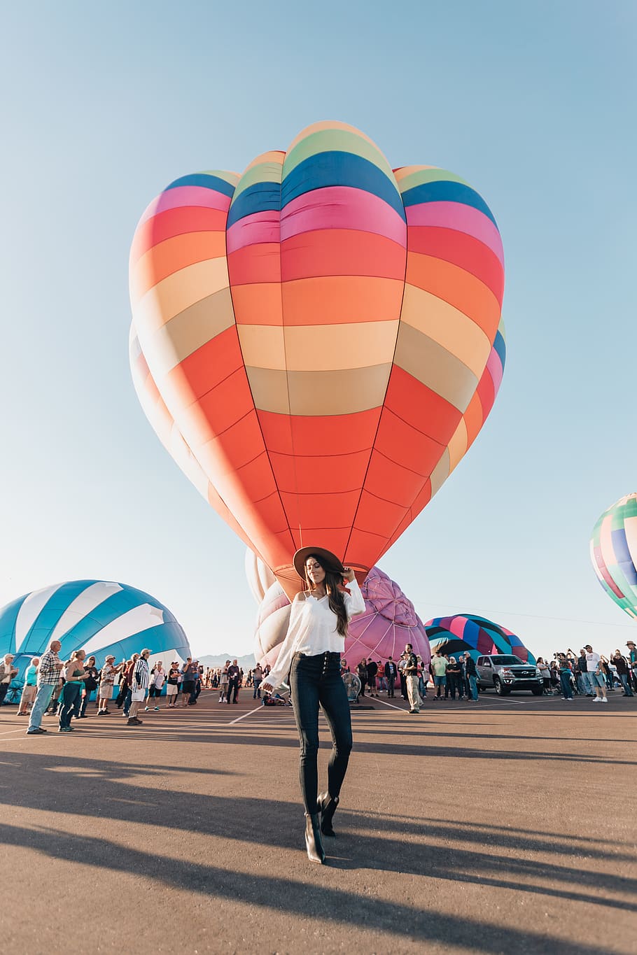 woman standing near hot air balloon during daytime, person, human