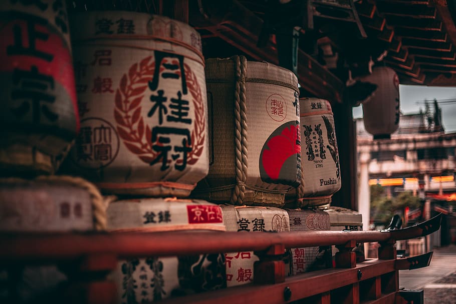 white-and-red wicker basket on shelf, beverage, alcohol, sake