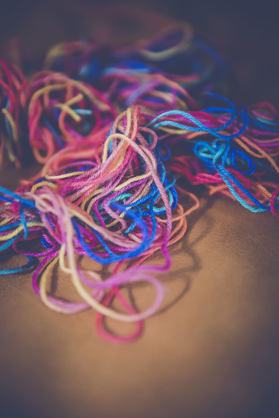 Blue Teal Pink Orange and Yellow Yarn Tangled With Each Other HD wallpaper