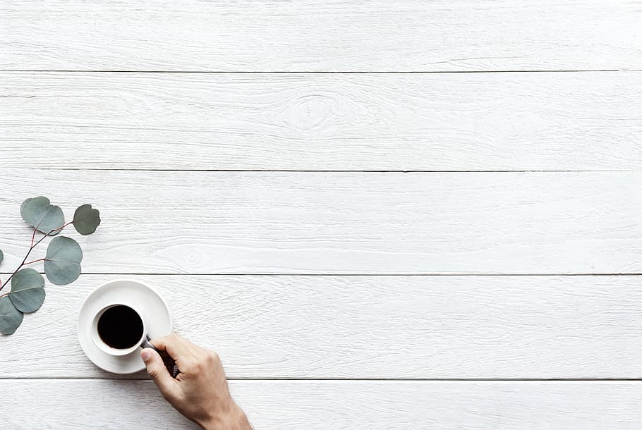 Person Holding White Ceramic Teacup With Black Coffee, beverage