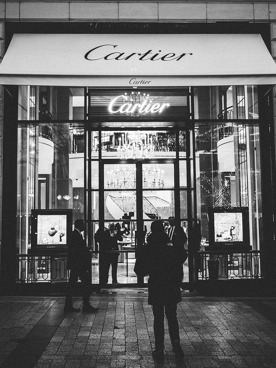 person standing front of Cartier signage, communication, text, HD wallpaper
