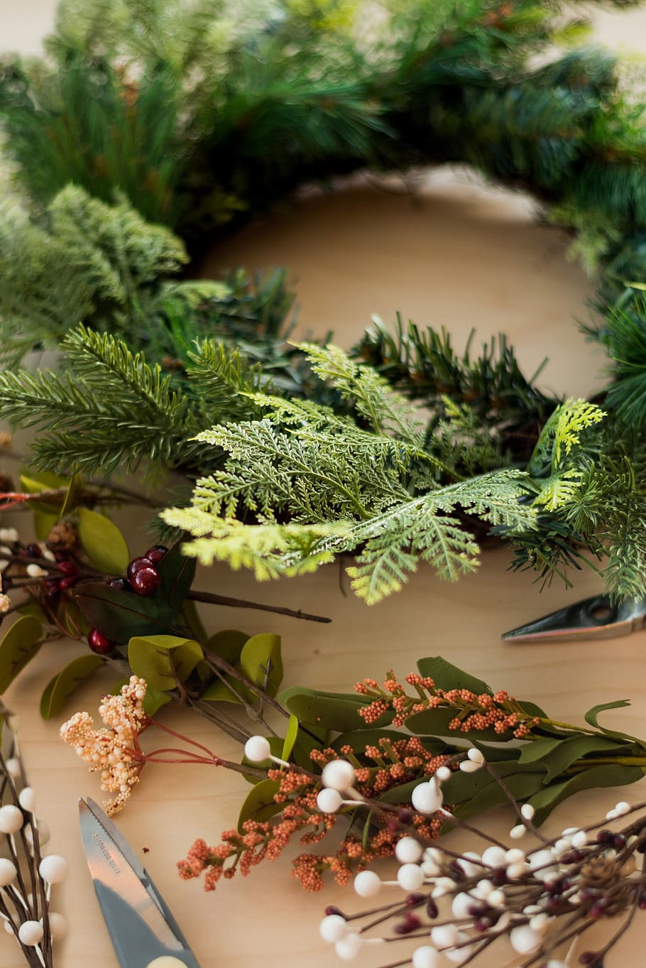 Christmas wreath on brown surface, tree, plant, conifer, fir HD wallpaper