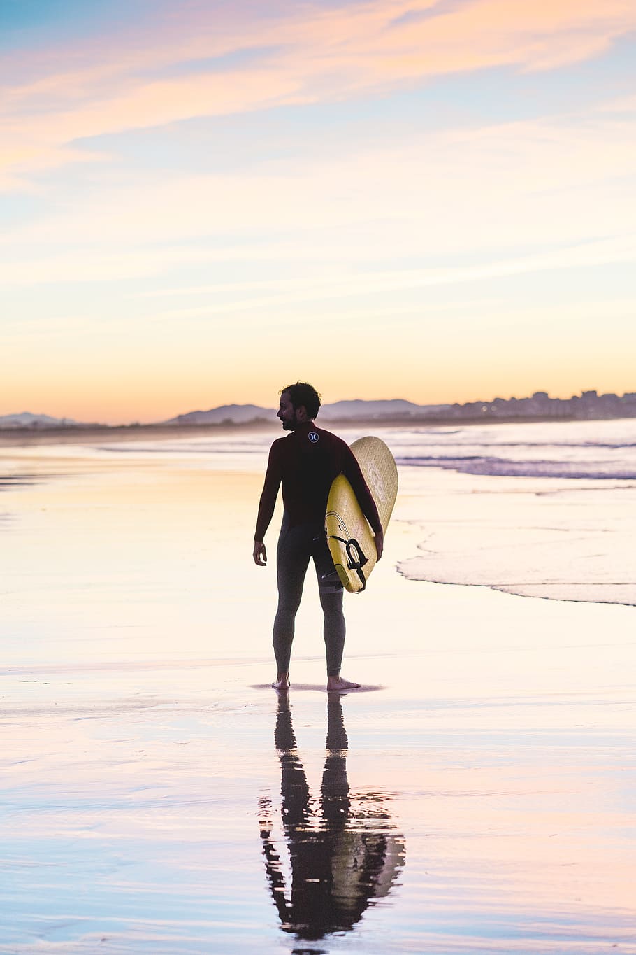 man holding surfboard standing on shore, male, surfer, water HD wallpaper