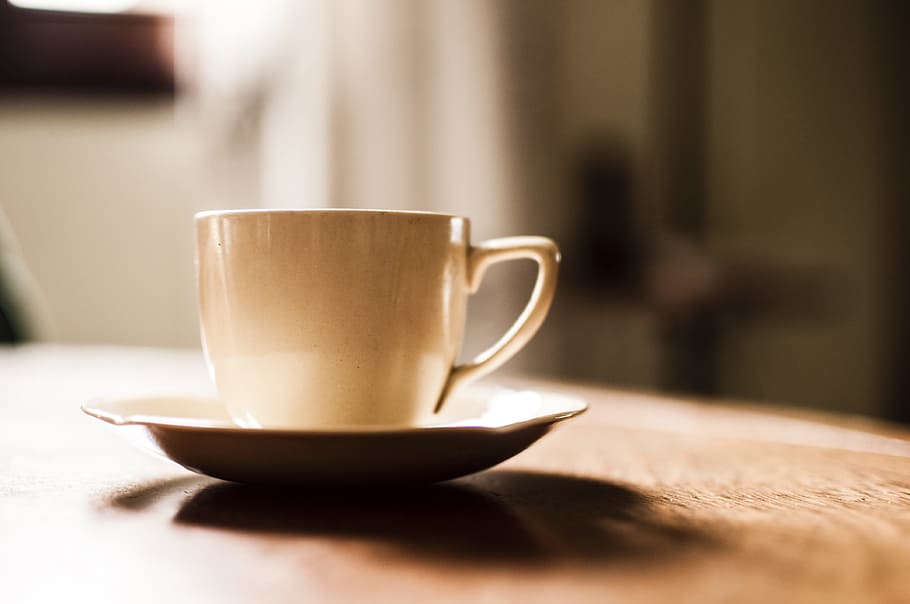 White Ceramic Teacup With Saucer on Wooden Table, blurred background HD wallpaper