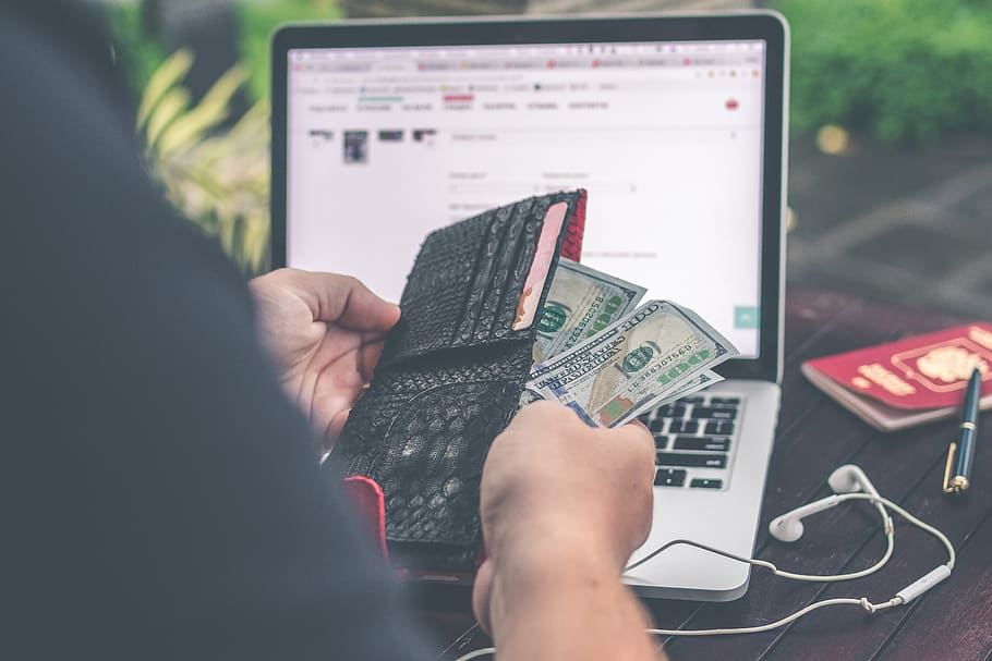 Person Holding 10 Us Dollar Banknote in Front of Gray and Black Laptop Computer, HD wallpaper