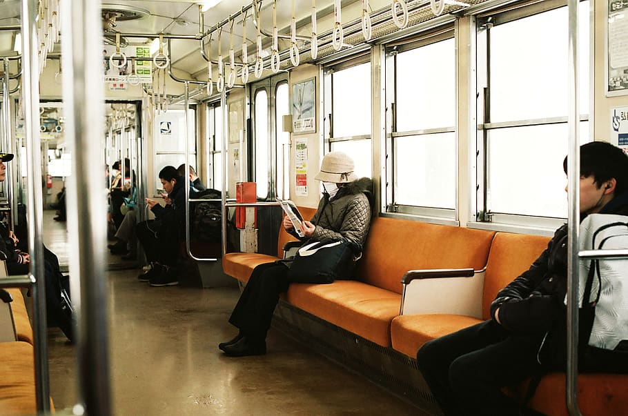 man sitting inside the train, group of people, real people, seat HD wallpaper