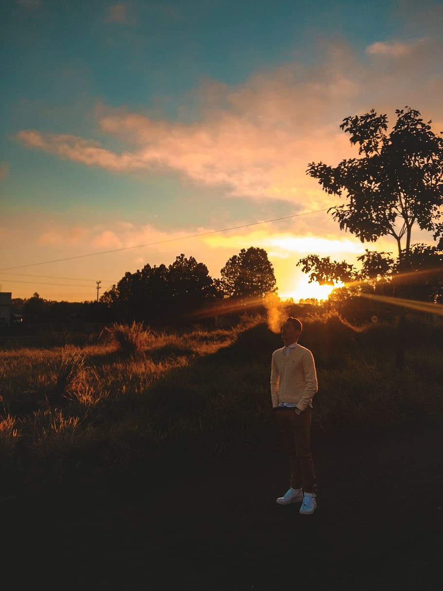 Man Standing On Grass During Golden Hour, backlit, dawn, person HD wallpaper