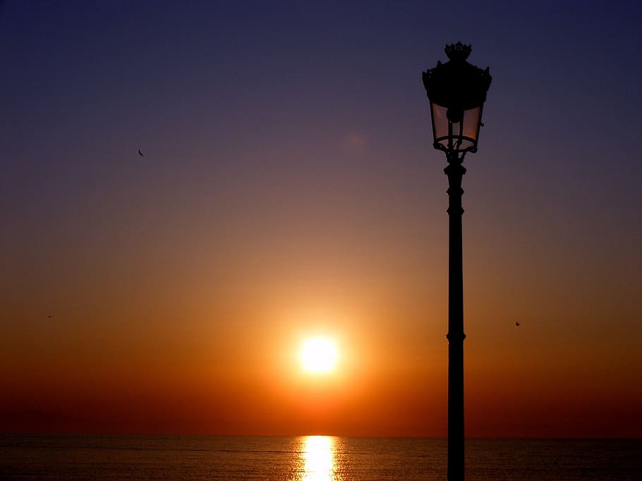 lantern, light, nature, glare, water, flow, sea, sky, sunset HD wallpaper
