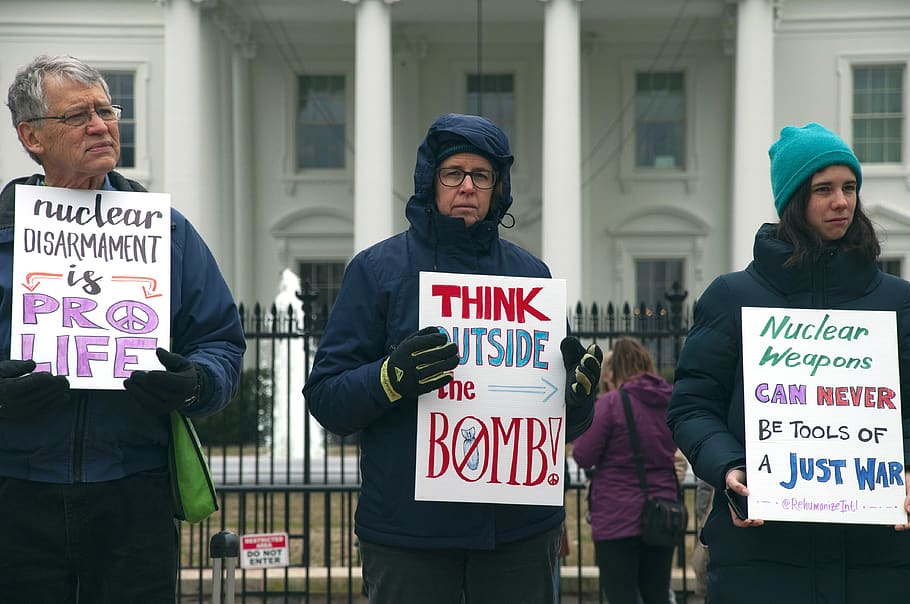 three man and women holding signs in front of The White House, Washington D.C. during day, HD wallpaper