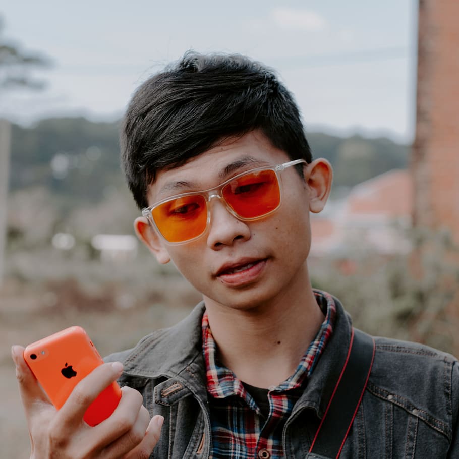 Man Wearing Blue Denim Jacket, apple, boy, cellphone, daytime HD wallpaper
