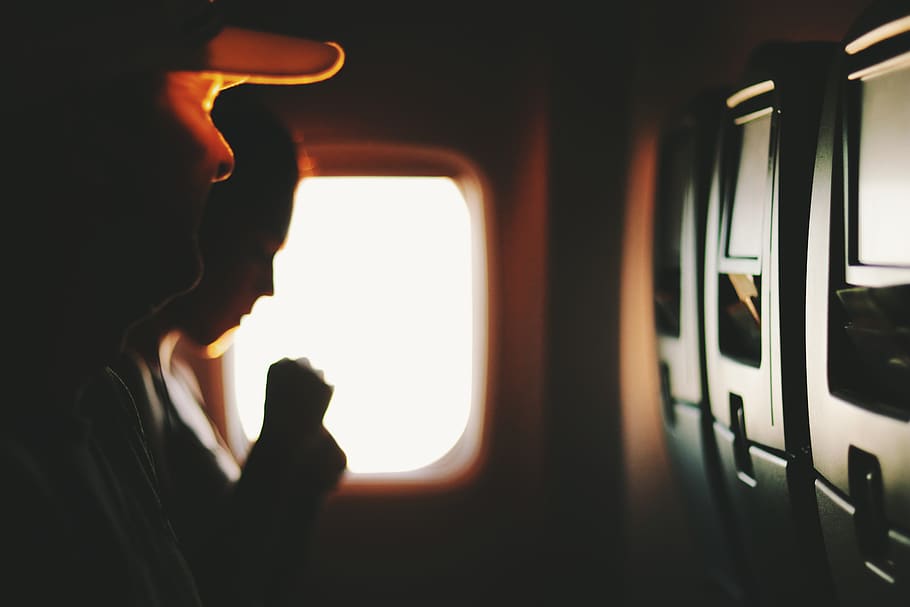 Two People Sitting Near Window Inside Plane, aeroplane, aircraft