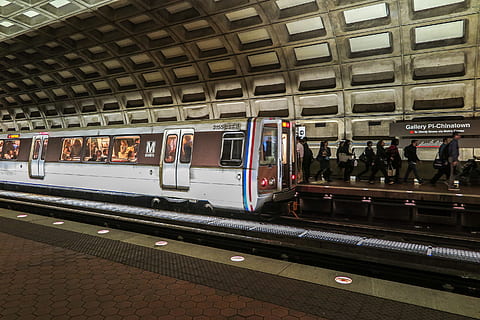 Trains arriving and leaving in DC metro station with riders on platform. HD wallpaper